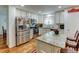 Bright kitchen with white cabinets, stainless steel appliances, and a granite island at 8555 Angela Ln, Parker, CO 80134
