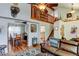 Open-concept living area features hardwood floors and stylish decor flowing into the dining area at 8555 Angela Ln, Parker, CO 80134
