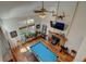 Bright living room boasts hardwood floors, high ceilings, pool table, and a cozy fireplace at 8555 Angela Ln, Parker, CO 80134