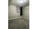 Spacious finished basement bedroom with window and carpet at 3092 S Kearney St, Denver, CO 80222