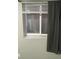 Basement window with window well and black curtain at 3092 S Kearney St, Denver, CO 80222