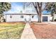 Front of house with lawn, walkway and attached garage at 3092 S Kearney St, Denver, CO 80222