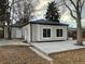 Rear view of house showing patio and landscaping at 3092 S Kearney St, Denver, CO 80222