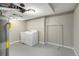 Basement laundry room with washer, dryer and clothes rack at 3092 S Kearney St, Denver, CO 80222