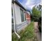 Home exterior featuring vinyl siding, brick, and a driveway with a vehicle at 882-888 Wolff St, Denver, CO 80204
