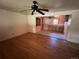 View of open living room, connecting to a kitchen with tile flooring and ample cabinetry at 882-888 Wolff St, Denver, CO 80204