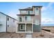 Inviting three-story home featuring a charming balcony and well-maintained landscaping, creating a welcoming facade at 13586 E 103Rd Pl, Commerce City, CO 80022