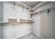 The well-organized closet offers ample storage space with adjustable shelving and hanging rods for convenience at 13586 E 103Rd Pl, Commerce City, CO 80022