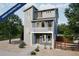 Stunning two-story home showcasing modern architecture, a balcony, and a well-kept gravel yard at 13586 E 103Rd Pl, Commerce City, CO 80022