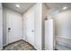 Bright entryway featuring a wood floor, gray rug, closet, and stairs leading to the upper level at 13586 E 103Rd Pl, Commerce City, CO 80022