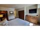 Bright bedroom with a dresser and a view into the kitchen at 555 S Park Ave # 202, Breckenridge, CO 80424