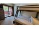 Bedroom with full-size and twin-size bunk beds at 555 S Park Ave # 202, Breckenridge, CO 80424