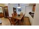 Bright dining area with a wood table and chairs, adjacent to kitchen at 555 S Park Ave # 202, Breckenridge, CO 80424
