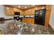 Kitchen boasts granite countertops and modern black appliances at 555 S Park Ave # 202, Breckenridge, CO 80424