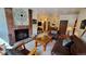 Living room with fireplace, leather furniture, and access to dining area at 555 S Park Ave # 202, Breckenridge, CO 80424