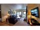 Cozy living room features a fireplace and leather furniture at 555 S Park Ave # 202, Breckenridge, CO 80424