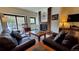 Living room with fireplace, leather sofas, and a coffee table at 555 S Park Ave # 202, Breckenridge, CO 80424