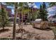 Community outdoor space with a built-in grill and seating at 555 S Park Ave # 202, Breckenridge, CO 80424