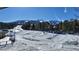 Sunny ski slope view with snow-covered ground and mountain background at 555 S Park Ave # 202, Breckenridge, CO 80424