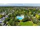 Overhead shot showcasing a community pool, lush trees, and a picturesque neighborhood setting at 2538 Central Park Blvd, Denver, CO 80238