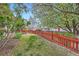 Back yard features a small patch of grass enclosed by a low fence at 2538 Central Park Blvd, Denver, CO 80238