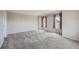 Spacious bedroom with plush carpet and neutral walls, offering ample natural light at 2538 Central Park Blvd, Denver, CO 80238