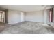 Spacious bedroom with plush carpet, neutral walls, and abundant natural light at 2538 Central Park Blvd, Denver, CO 80238