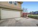 Two-story home featuring an attached garage and a well-maintained front exterior at 2538 Central Park Blvd, Denver, CO 80238