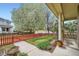 Charming front porch with decorative columns and a view of the landscaped front yard at 2538 Central Park Blvd, Denver, CO 80238