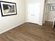 Bright bedroom featuring wood floors, neutral walls, a closet, and a framed photo for a cozy ambiance at 4451 S Ammons St # 108, Littleton, CO 80123