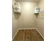 A walk-in closet has wire shelving for organized storage solutions and wood-style flooring at 4451 S Ammons St # 108, Littleton, CO 80123