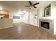 Spacious living room with a fireplace, wood flooring, and an open layout at 4451 S Ammons St # 108, Littleton, CO 80123