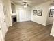 Bright living room with a fireplace, blinds, and wood flooring at 4451 S Ammons St # 108, Littleton, CO 80123