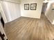 Living room featuring a sliding glass door, wood flooring, and neutral wall color at 4451 S Ammons St # 108, Littleton, CO 80123