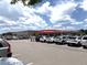 Spacious parking lot filled with cars in front of a Costco retail store, providing convenient shopping access at 4451 S Ammons St # 108, Littleton, CO 80123
