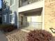 Outdoor patio with a view, featuring a cozy seating area and manicured landscaping at 4451 S Ammons St # 108, Littleton, CO 80123