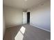 Comfortable bedroom with large windows and neutral-toned walls and carpet at 48299 Shetland Dr, Bennett, CO 80102