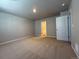 Neutral bedroom with a walk-in closet and easy access to an attached bathroom at 48299 Shetland Dr, Bennett, CO 80102