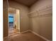 Large walk-in closet with an open floor plan for extra storage and shelving at 48299 Shetland Dr, Bennett, CO 80102