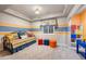 bedroom featuring a colorful design, comfortable daybed, and bright lighting fixtures, fostering a creative atmosphere at 5118 Bottlebrush Run, Broomfield, CO 80023