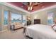 Serene bedroom featuring a cozy sitting area by a large window with views of the surrounding landscape at 5118 Bottlebrush Run, Broomfield, CO 80023