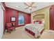 Elegant bedroom featuring a ceiling fan, built-in shelving, and a window that provides plenty of natural light at 5118 Bottlebrush Run, Broomfield, CO 80023