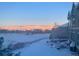 Scenic winter view of the exterior of the home, featuring a snowy landscape and mountain backdrop at 5118 Bottlebrush Run, Broomfield, CO 80023