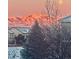 Beautiful exterior view of the home with snow-covered mountains as a backdrop at 5118 Bottlebrush Run, Broomfield, CO 80023