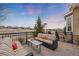 This patio features a striped outdoor couch with a scenic neighborhood view at 5118 Bottlebrush Run, Broomfield, CO 80023