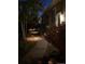 Tranquil walkway with landscape lighting creating a warm and inviting pathway at 5118 Bottlebrush Run, Broomfield, CO 80023