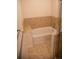 Bathtub with tiled surround and glass shower door offers a relaxing bathing experience at 16180 E Geddes Ln # 14, Aurora, CO 80016
