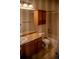 Bathroom featuring a sink, toilet, cabinet, and shower/tub combo at 16180 E Geddes Ln # 14, Aurora, CO 80016