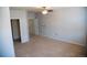 Large bedroom with carpeted flooring, neutral paint and access to multiple doors at 16180 E Geddes Ln # 14, Aurora, CO 80016