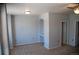 Neutral bedroom with a built-in shelf, ceiling fan and carpeted flooring at 16180 E Geddes Ln # 14, Aurora, CO 80016